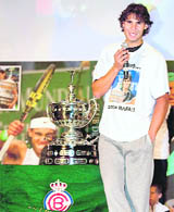 Rafael Nadal gives a speech after receiving a full-size replica of the Conde de Godo trophy at the Barcelona Royal Tennis Club on Thursday.