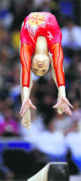 Deng Linlin of China performs her routine in the womens beam final at the Gymnastics World Championships in London last week. Deng won the event
