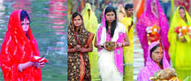 Women pray to the setting sun on the occasion of Chhat Puja at the India Gate pond in New Delhi on Saturday. 