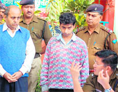 SSP Sanjay Gunjiyal (extreme right) interrogates the murder accused in Haridwar on Saturday.