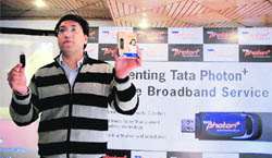 TPS Walia, chief operating officer, Punjab and Haryana, Tata Teleservices Limited,  showing the device.