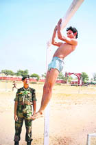 A youth undergoes a physical fitness test during an Army recruitment rally in Jammu