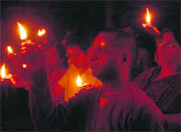 ISKCON devotees offer lamps to Lord Damodar at Hare Krishna Dham, Sector 36-B, Chandigarh, on Sunday. 