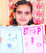 Ishita Uppal shows anti-foeticide posters.