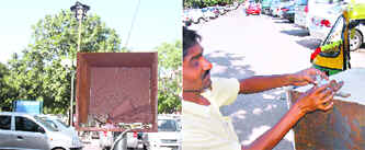 Clothes of employees lie in a CCTV camera box in front of the Sagar Ratna parking lot; and (right) a contractor locks the CCTV camera box in Sector 17, Chandigarh.