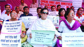 On the occasion of the third anniversary of the Domestic Violence Act, activists under the banner of the Save Family Foundation protest against the misuse of women protection laws and demand gender neutrality of the act, at Jantar Mantar in New Delhi on Sunday. 