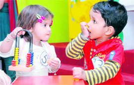 Kids enjoy their biscuits at a function on Sunday.