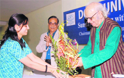 Prof Yash Pal being felicitated at Doon University in Dehradun on Sunday as Vice-Chancellor Dr Girijesh Pant looks on.