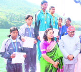 Uttarakhand Tourism Minister Madan Kaushik (in red cap) after presenting medals to the winners at the National Kayaking and Canoeing Championship.