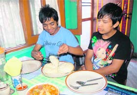 Boys enjoy Tibetan dishes at Lhasa in Dehradun