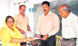 Deputy Controller, Civil Defence, Bodh Raj distributes certificates among civil-defence volunteers at Udhampur on Sunday. 