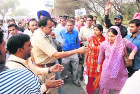The police tries to pacify delegates of BEd Teachers Front during a rally held at Lambi