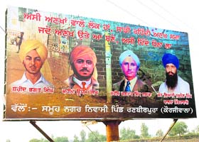 A hoarding displays photographs of Shaheed Bhagat Singh, Shaheed Udham Singh and Shaheed Kartar Singh Sarabha along with Sikh ideologue Jarnail Singh Bhinderanwale on the Sangrur road, 7 km away from Patiala