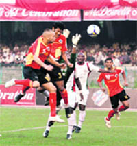 Players of East Bengal and Mohun Bagan in action on Sunday.