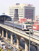 A Metro train runs on the New Delhi-Noida line