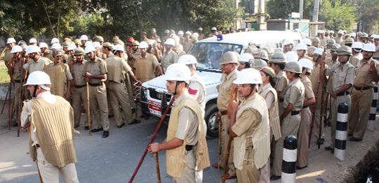 Policemen keep a vigil outside RICO company as its employees protest in Gurgaon 