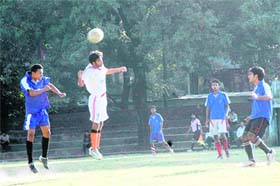 Players try to head the ball in the 9th Gautam Gurung Memorial Football Tournament being played in Dehradun