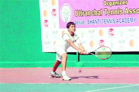 A player in action the tennis tournament at Shanti in Dehradun