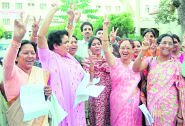 Nurses rejoice after the state government acceded to their demands in Dehradun on Monday.