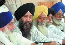 Members of the Riot-Affected Welfare Society address a press conference in Jalandhar on Monday.