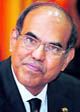 RBI Governor Duvvuri Subbarao poses for photographers before a meeting with bankers in Mumbai on Tuesday