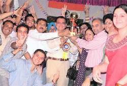 Youth festival overall trophy winner SD College receives trophy from IGP Rajbir Singh Deswal at SA Jain College in Ambala City