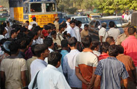 Traffic comes to a halt as a person was killed in an accident between a truck and a motorcycle at Mathura Road in Faridabad on Tuesday.