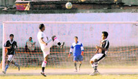 A player attempts a goal at the 9th Gautam Memorial Football Tournament in Dehradun on Tuesday. 