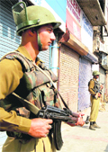  CRPF jawans keep vigil at Lal Chowk inSrinagar on Tuesday.