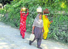Women in Reasi have to travel a long distance to fetch water for daily chores.
