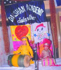 Tiny tots from Darshan Academy deliver a performance during a cultural programme