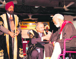 Governor S.F. Rodrigues confers the PhD degree on a scholar at the convocation of Guru Nanak Dev University in Amritsar on Tuesday.
