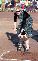 US pop star Madonna plants a tree at a ground breaking ceremony for her Raising Malawi Academy for Girls in Malawi (Africa).