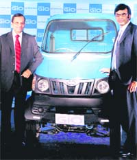 Mahindra & Mahindra (automotive sector) president, Pawan Goenka with chief of operations, Rajesh Jejurikar (R) at the launch of a new compact truck 'Gio' in Mumbai