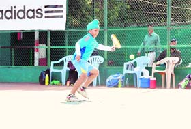 A player in action at the AITA Championship Series Tennis Tournament at Shanti Tennis Academy, Dehradun