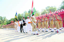 Newly recruited jawans of the ITBP take oath at a passing-out parade in Dehradun on Wednesday.