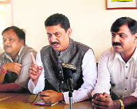 Rakesh Pathania, MLA, addressing a press conference at Dharamsala on Wednesday.