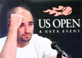 n this file picture Andre Agassi is seen during a news conference following his lost match against Patrick Rafter at the U.S. Open