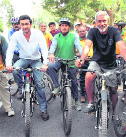  Ranbir Kapoor with film director Prakash Jha at a bicycle rally as part of an environment awareness campaign in Bhopal on Tuesday.