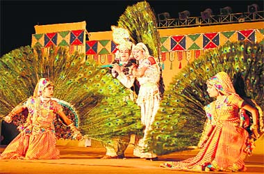 Artistes perform a dance during the National Crafts Mela at Kalagram in Chandigarh