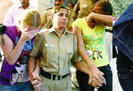 Three girls being produced at Patiala House court in New Delhi on Thursday.