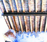 Roof of a room in Mandi Ahmedgarh police station that has developed cracks.
