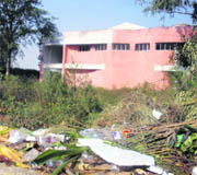 Garbage lies on the premises of Shiv Batalvi Memorial Auditorium at Batala.