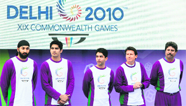 England cricketer Monty Panesar (L), boxer Vijender Kumar (2nd L), air rifle shooter Abhinav Bindra (C), British Olympic athlete and Chairman of the London 2012 Organising Committee, Sebastion Coe (2nd R) and cricketer Kapil Dev (R), are pictured in the grounds of Buckingham Palace in central London, on Thuesday.