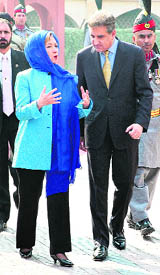 US Secretary of State Hillary Clinton walks with Pakistani Foreign Minister Shah Mehmood Qureshi at Iqbals Mausoleum in Lahore on Thursday. 