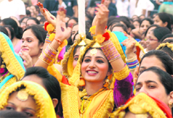 A gidda team member cheers her bhangra team at the youth fest in Chandigarh on Friday.