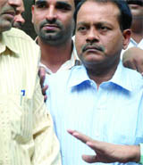 Munna Bajrangi (c) being taken to court in New Delhi on Friday.
