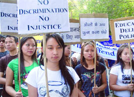 Naga students participate in a protest march against problems faced by North East students, at Jantar Mantar in New Delhi on Friday.