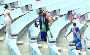 Workers clean chairs on the eve of the third one-day international cricket match between India and Australia at Ferozshah Kotla Ground in New Delhi on Friday.