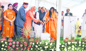 BJP national president Rajnath Singh and Chief Minister Prem Kumar Dhumal at the foundation stone laying ceremony of Vatsalya Gram near Nalagarh on Friday.
